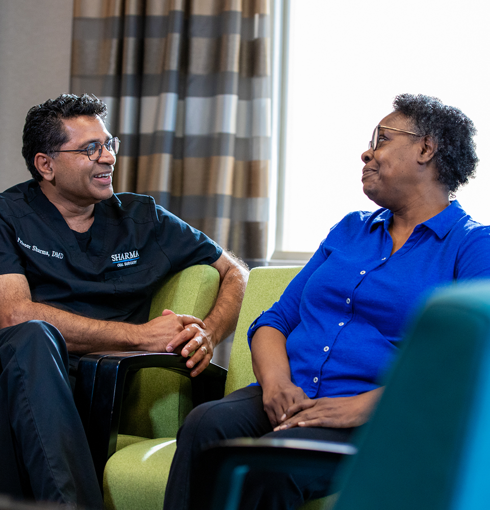 sharma with patient relaxed comfortable office